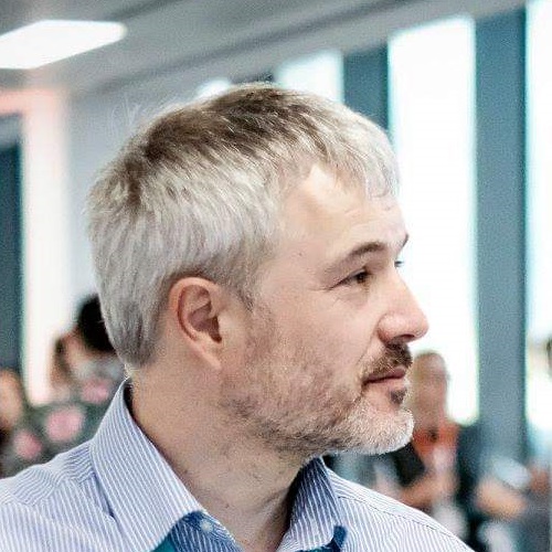 Kevin listening to a UX practitioner Photograph of Kevin listening to a UX practitioner